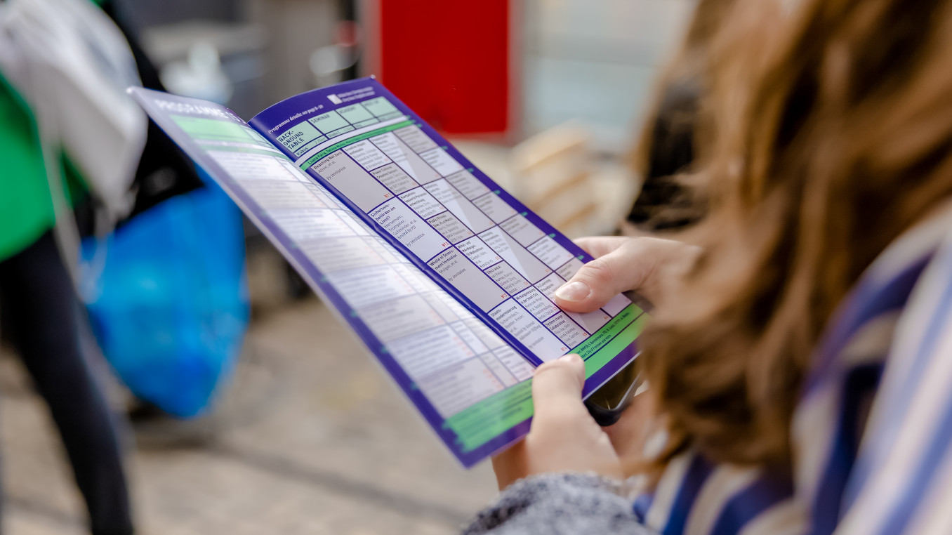 woman looking at the programme calendar 